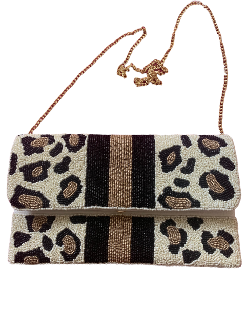 Leopardess On The Move Clutch