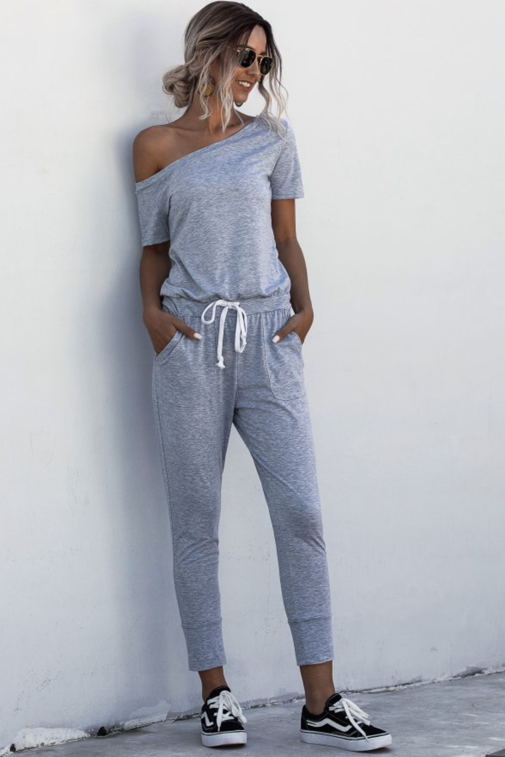 Load image into Gallery viewer, Asymmetrical Neck Tied Jumpsuit with Pockets
